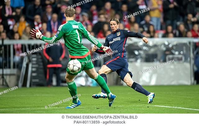Bayern Munich's goalkeeper Manuel Neuer and Madrid's Fernando Torres in action during the UEFA Champions League semi final soccer match FC Bayern Munich vs...