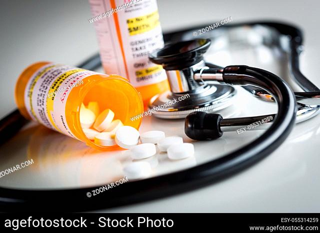 Non-Proprietary Medicine Prescription Bottles and Spilled Pills Abstract with Stethoscope
