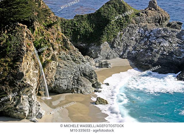McWay Falls in Julia Pfeiffer Burns State Park along Pacific Coast Highway in California during the springtime.  McWay Falls at McWay Falls State Park along the...