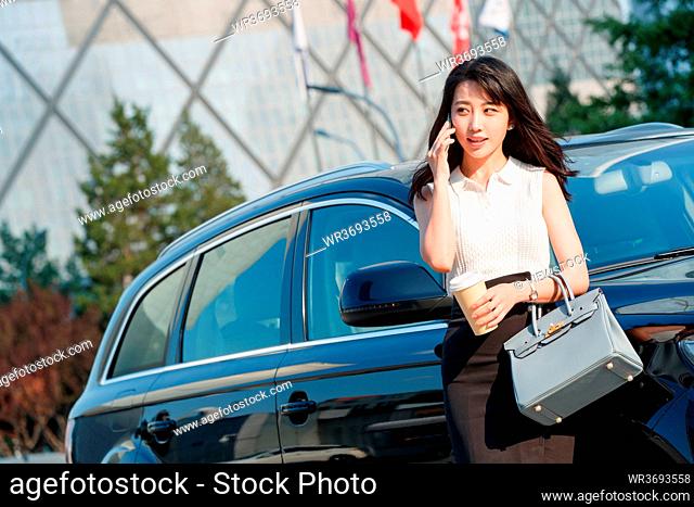 Young woman on the phone business