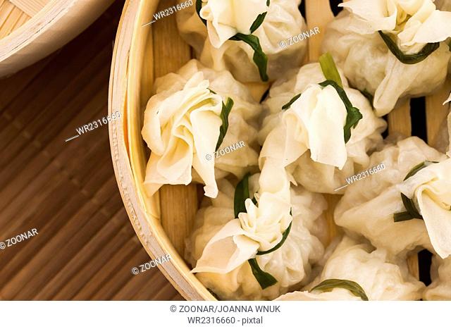 Chinese dumplings in bamboo steamers