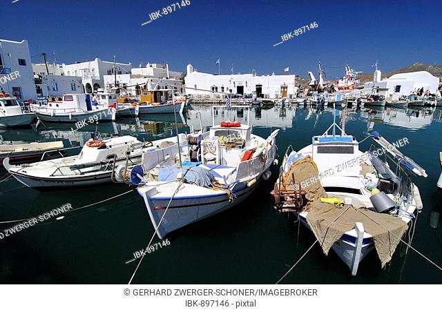 Fishing boats anchored in the port of Naoussa, Paros, Cyclades, Greece, Europe