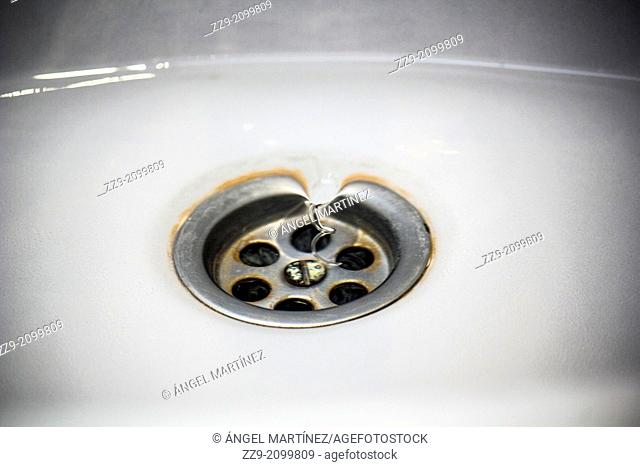 Whirlpool of water entering the drain