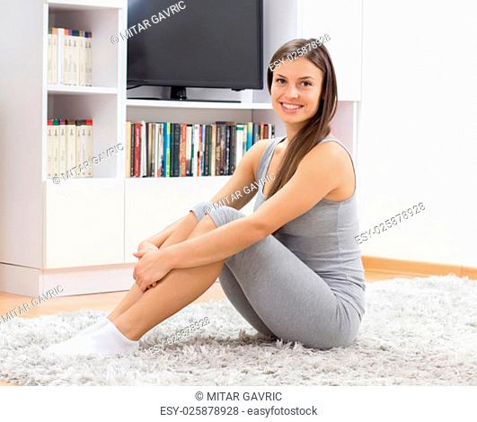 Fit Young Woman Relax at home. Yoga Meditation.Caucasian female relaxing at home. Healthy Lifestyle