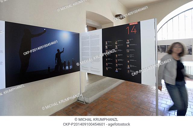Journalists visit the international exhibition of journalistic photography World Press Photo in Prague, Czech Republic, September 10, 2014