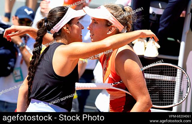 Colombian Maria Camila Osorio Serrano and Belgian Elise Mertens embrace after their tennis match in the second round of the women's singles at the Roland Garros...