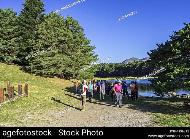 senior trekking group, Bassa d'Oles, Montcorbison, Aran Valley, Lérida province, Spain