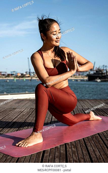 Asian woman practicing yoga
