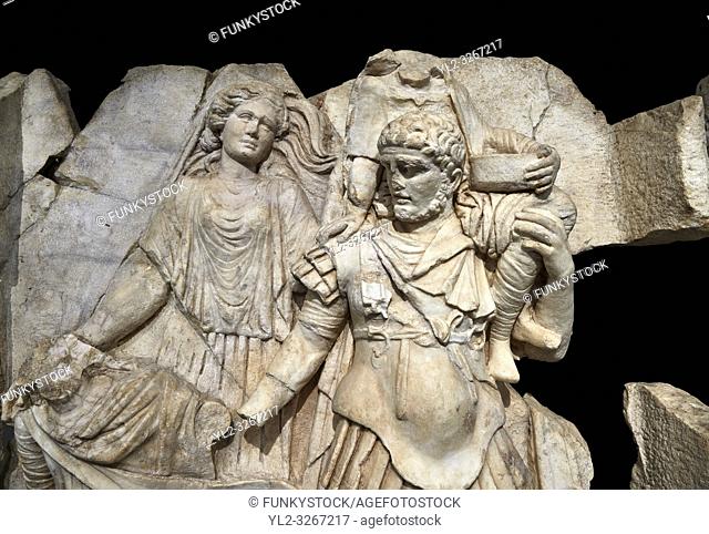 Close up of a Roman Sebasteion relief sculpture of Aineasâ. . flight from Troy, Aphrodisias Museum, Aphrodisias, Turkey. Against a black background