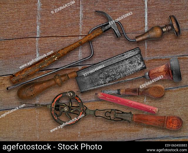 vintage woodworking tools over weathered drift wood background