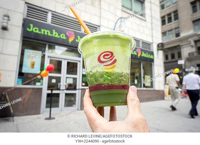 An customer with her Jamba Juice outside a store in the Chelsea neighborhood of New York. The juice and smoothie chain recently reported second quarter sales...