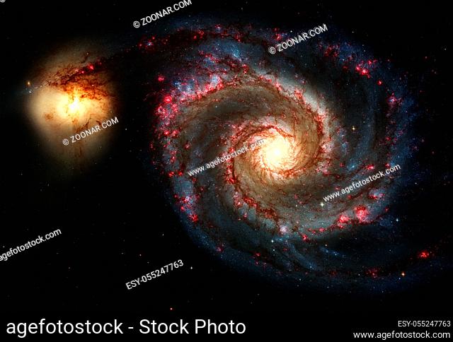 Whirlpool Galaxy and Companion. Winding arms of the spiral galaxy M51 or NGC 5194 appear like a grand spiral staircase sweeping through space