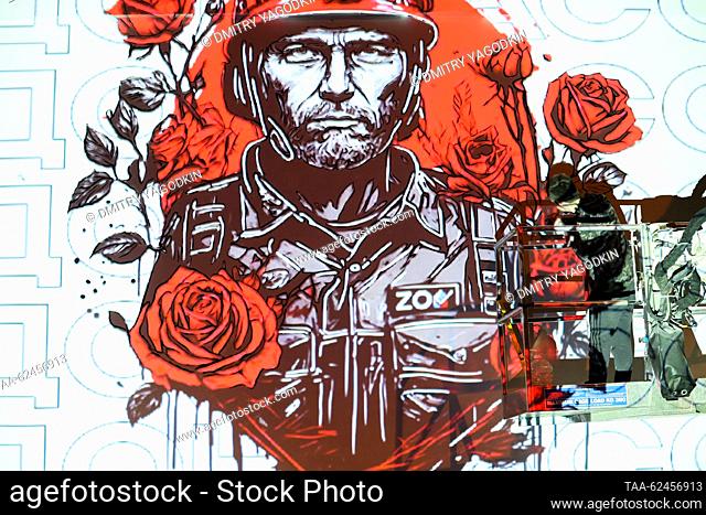RUSSIA, DONETSK - SEPTEMBER 21, 2023: Artist Vladislav Stepnoi paints a mural in Donetsk's Kalininsky District as part of preparations for the celebration of...