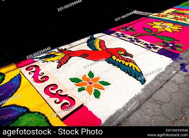 Alfombra, colorful sawdust carpet with parrot on street made for Semana Santa, Easter, Santiago Atitlan, Guatemala
