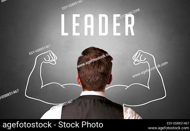Rear view of a businessman with LEADER inscription, powerfull business concept