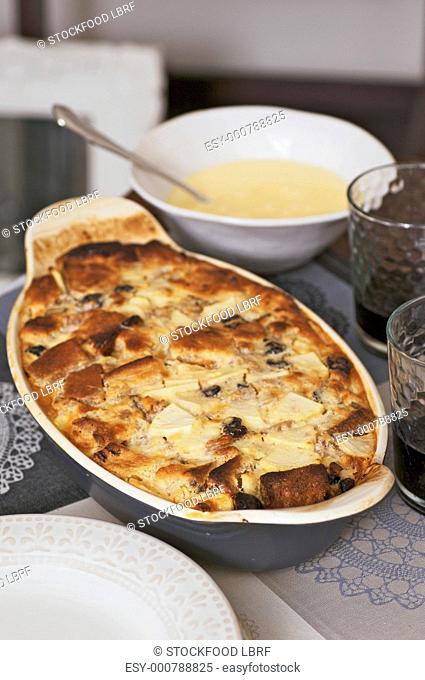 Bread and butter pudding with blueberries and custard