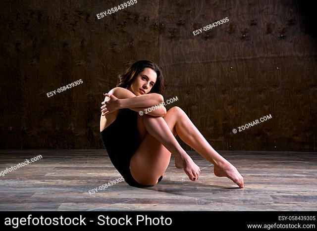 Abstract and stress emotional concept. depressed girl in lonely mood, theme of stressful. Sad woman sitting alone in empty room