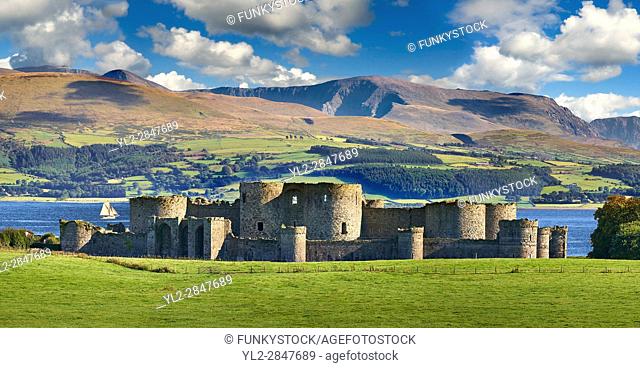 Beaumaris Castle, looking towards Snowdonia, built in 1284 by Edward 1st, considered to be one of the finest example of 13th century military architecture by...