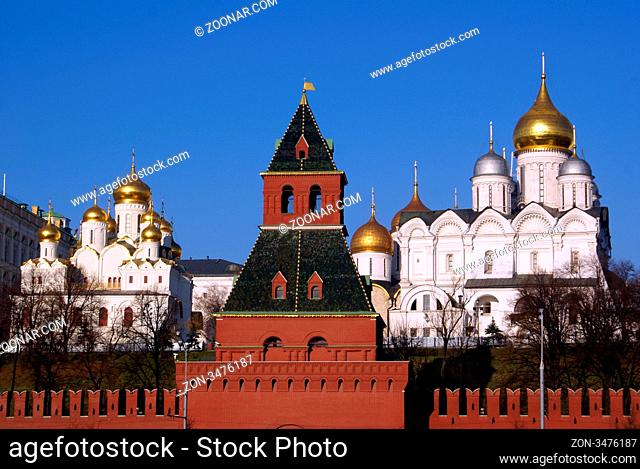 Red tower and white cathedrals in Kremlin, Moscow, Russia