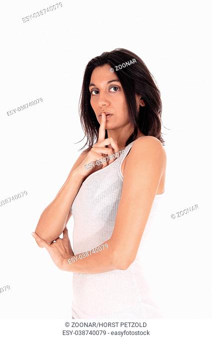 Woman holding finger over mouth