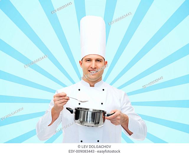 cooking, profession and people concept - happy male chef cook with pot and spoon over blue burst rays background