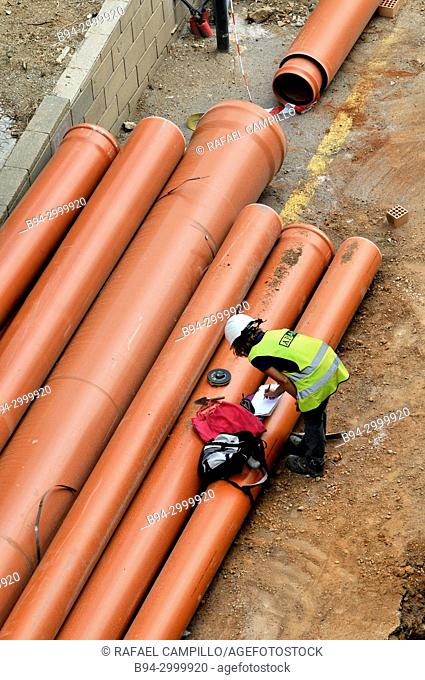Engineering works and pipe placement. Barcelona, Catalonia, Spain