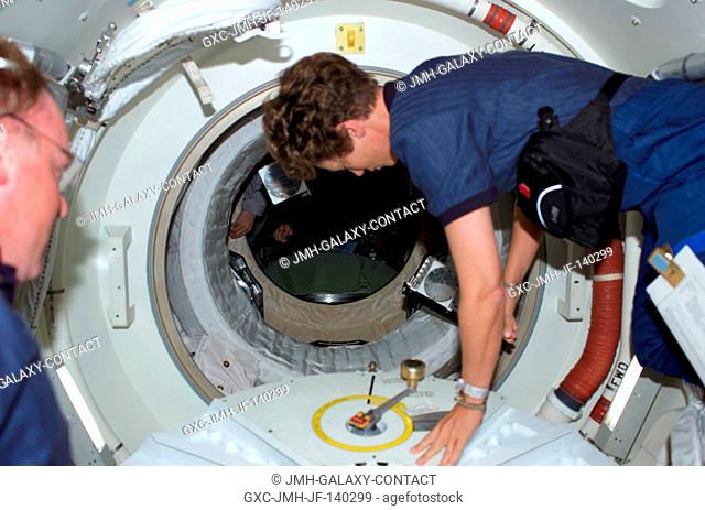 Astronaut Eileen M. Collins, STS-114 commander, has just opened the hatch that will lead her and the entire Discovery crew into the International Space Station