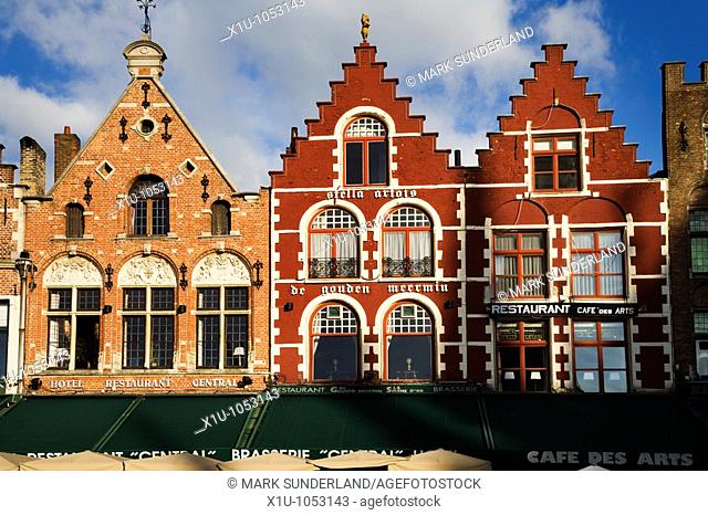 Colourful gabled buildings in the market square Bruges Belgium