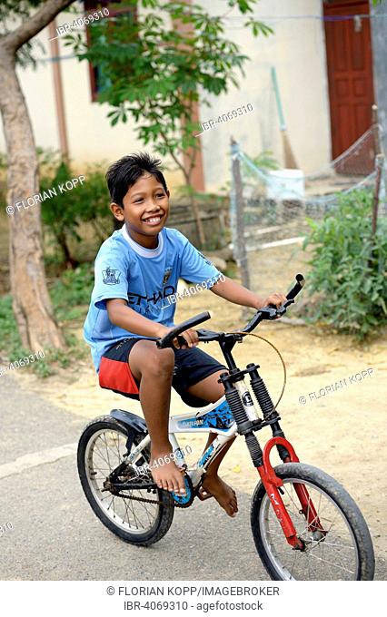 Boy on a bicycle, Banda Aceh, Indonesia