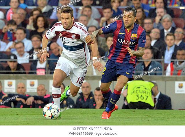 Barcelona's Dani Alves (R) and Munich's Juan Bernat vie for the ball during the UEFA Champions League semi-final first leg soccer match betweeen FC Barcelona...