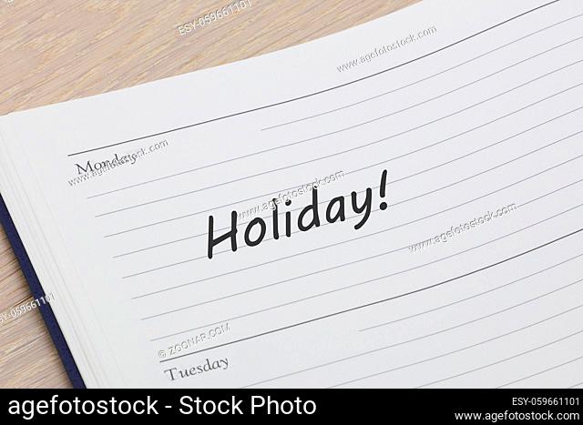 A holiday reminder note in a diary page