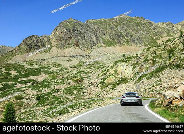 Porsche GT3 sports car crosses 2350-metre Passo Lombarda pass above tree line on French-Italian border, Colle della Lombarda, Département Alpes-Maritimes