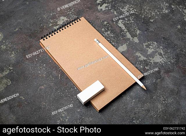 Blank kraft notepad, pencil and eraser. Responsive design mockup. Template for placing your design