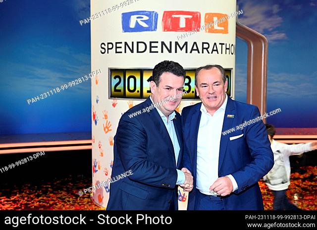 17 November 2023, North Rhine-Westphalia, Hürth: Federal Minister Hubertus Heil and presenter Wolfram Kons , l-r, take part in the 28th RTL Spendenmarathon wir...