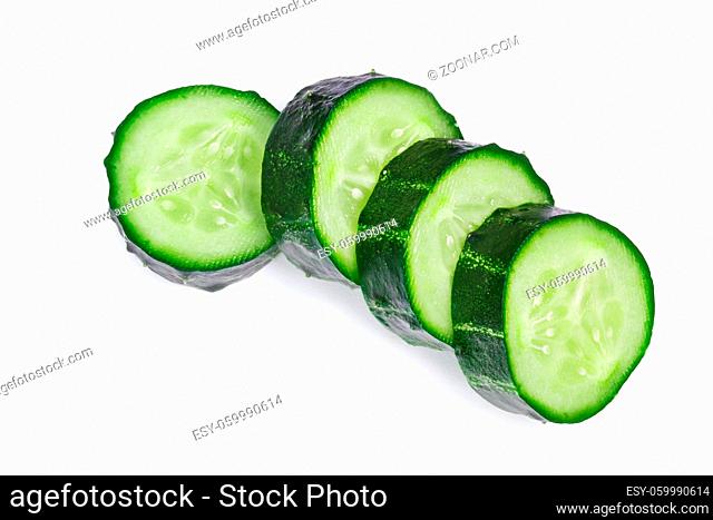 Fresh cucumber ring slices (Cucumis sativus), top view. Clipping paths, shadow separated
