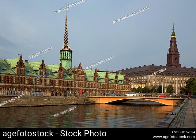 Panoramic view on Christiansborg Palace and Stock Exchange over the channel in Copenhagen, Denmark Copenhagen, Denmark on the Nyhavn Canal