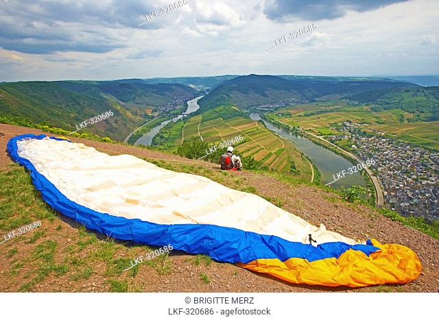 Paraglider above the Horse-shoe bend of the river Mosel with Bremm, Wine district, Rhineland-Palatinate, Germany, Europe