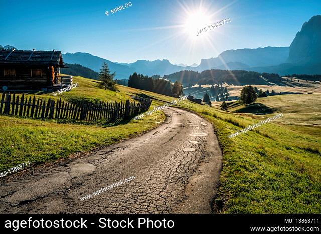 Morning landscape of Alpe di Siusi plateau road, Dolomites mountains, Italy