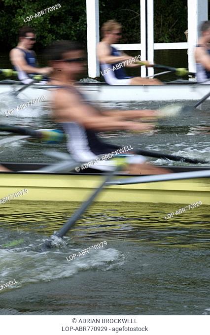 England, Oxfordshire, Henley-on-Thames, Boat crews rowing powerfully off the start line during a race at the annual Henley Royal Regatta