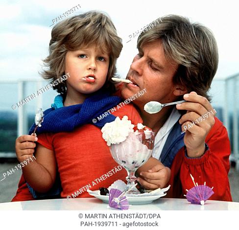 Wayne Carpendale munching a huge ice-cream alongside his father Howard Carpendale, pictured in June 1981. By now Wayne Carpendale is a handsome young man of 22...