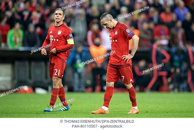 Bayern Munich's Franck Ribery (r) and Philipp Lahm (l) react during the UEFA Champions League semi final soccer match FC Bayern Munich vs Atletico Madrid in...