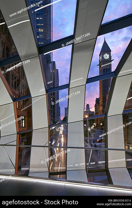 Evening view looking out through bridge structure to city. CF Eaton Centre Bridge, Toronto, Canada. Architect: Wilkinson Eyre Architects, 2018