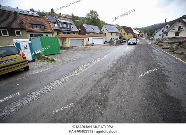A car passes through the town of Braunsbach, Germany, 03 May 2017. The town was ravaged by a landslide triggered by a storm on the evening of 29 May 2016