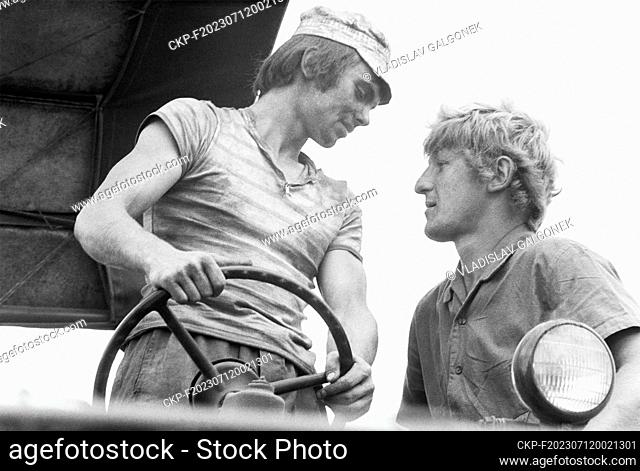 ***AUGUST 1st, 1977, FILE PHOTO*** Harvest work in Olomouc, 1 August 1977. Young combine harvesters Jan Navratil (right) and Jaroslav Dostal during their lunch...