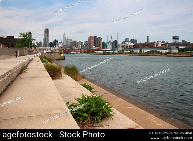 28 May 2021, US, New York: Steps lead to the East River in the ""Newtown Creek Nature Walk"" in the borough of Brooklyn. Artist George Trakas has been building...