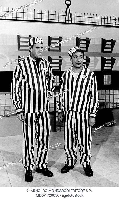 Ugo Tognazzi and Raimondo Vianello wearing prison uniforms in Un due tre. Italian TV presenter and actor Raimondo Vianello and Italian actor