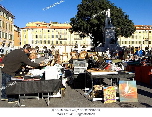 South of France, Nice, Place Garibaldi, Antique market, Laying out wares, early Spring morning, Browsers
