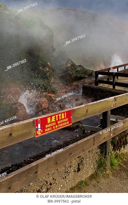 Warning sign on a fence, hot spring Deildartunguhver, highest-flow hot spring of Iceland with 180 liters of boiling water per second, Reykholtsdalur, Iceland