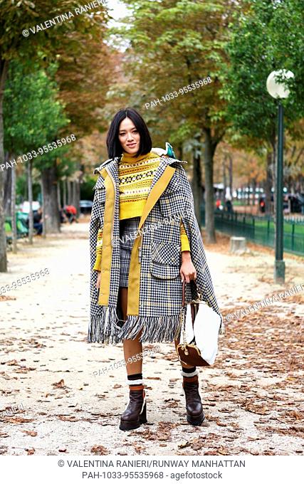 Blogger Tiffany Hsu posing outside of the Sacai runway show during Paris Fashion Week - Oct 2, 2017 - Photo: Runway Manhattan/Valentina Ranieri ***For Editorial...