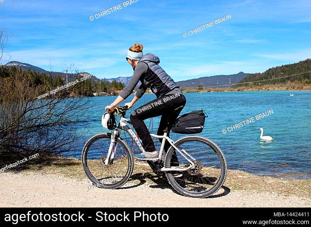 young woman riding mountain bike, reservoir near Krün, Germany, Bavaria, Upper Bavaria, Isar Valley, bicycle, Karwendel Mountains